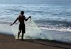 Fisherman on the black sands of Monterrico